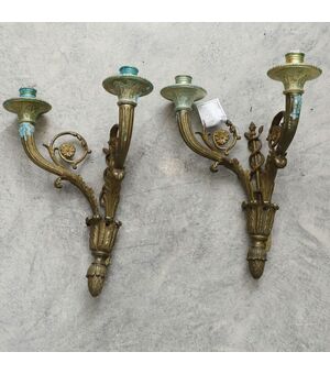 Pair of appliques in gilded bronze with two lights