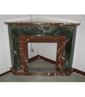 Antique corner fireplace in two-tone marble. Period early 1900     