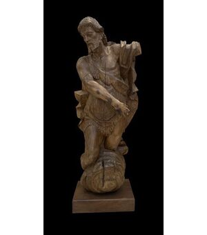 A magnificent life-size walnut sculpture of St. John the Baptist
