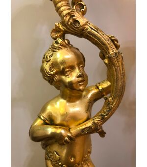 Coppia di flambeaux in bronzo dorato Francia XIX sec.