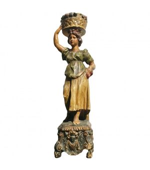 Polychrome wood sculpture depicting a female figure     