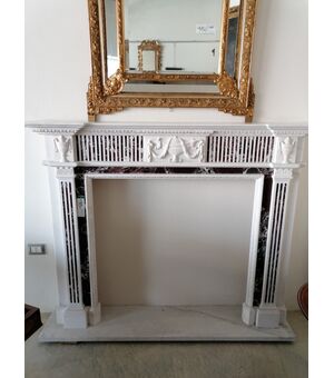 Fireplace in white and burgundy red marble with Louis XVI style decorations     
