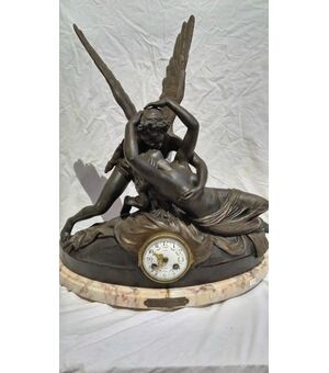 Antimony table clock and marble base depicting "Amour et Psyche"