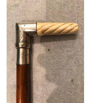 Stick with ivory and animated metal knob with a lighter.     