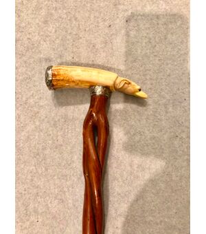 Stick with ivory knob with dog&#39;s head and woven cane.     