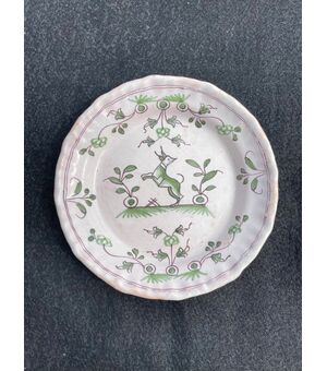 Majolica plate with stylized animal and vegetable decoration.Bordeaux, France.     