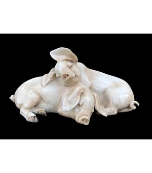 Pair of pigs in polychrome porcelain. Tay manufacture by Giuseppe Tagliariol. Monza     