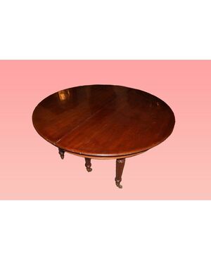 Tavolo circolare allungabile inglese di inizio 1800 stile Regency in legno di mogano con allunghe