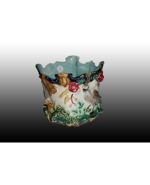 Porta vaso in ceramica riccamente decorata con anatre