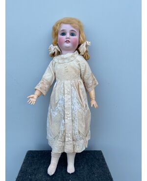 Doll with bisque head and papier-mâché body.Moving eyes.Germany     