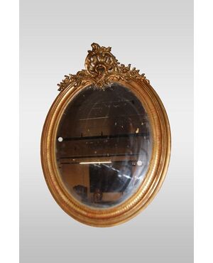 Specchiera ovale Luigi XV del 1800  francese dorata con cimasa foglia oro