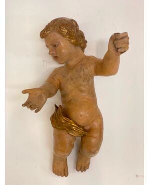 Putto ligneo cherubino scolpito laccato e dorato . XVII secolo Lombardia 