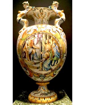 Large majolica vase with side sockets in the shape of harpies and Raphaelesque and grotesque decoration. Central medallion with historiated scene with characters. Cantagalli, Florence.     