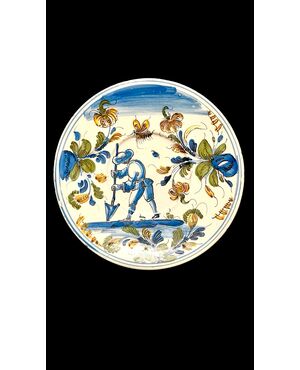 Piatto in maiolica con figura di contadino in ambiente agreste.Pavia.