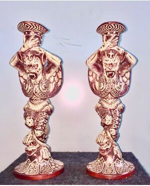 Pair of ruby luster majolica candlesticks with grotesque figures. Cantagalli manufacture. Florence.     