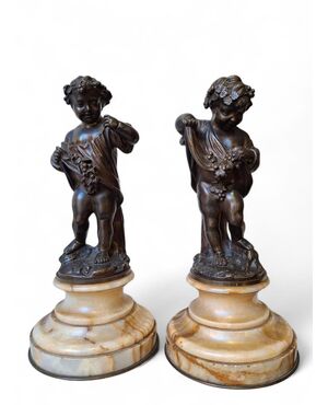 Coppia di putti in bronzo cesellato