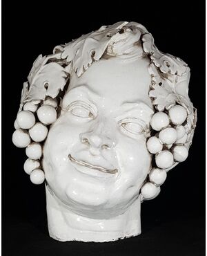 Testa di Bacco in terracotta smaltata in bianco