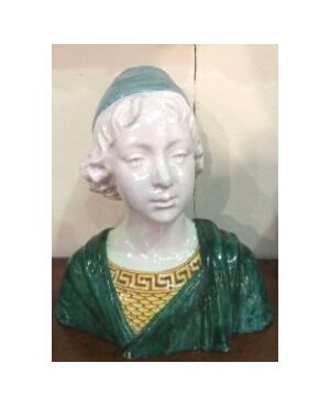 Bust in polychrome majolica with figure of a Renaissance boy.Manufactured by Angelo Minghetti.Bologna     