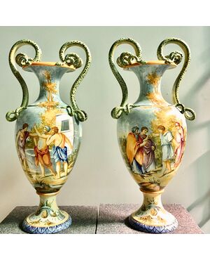 Pair of majolica vases with snake grips and historiated decoration.Manufactured by Giovanni Mollica.Naples.     