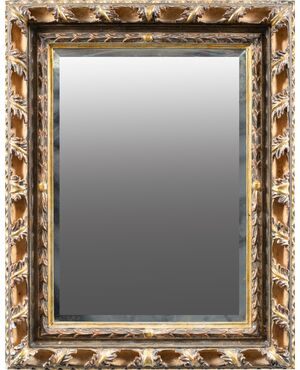 Specchiera Liberty in legno intagliato e dorato. Italia, XX secolo.
