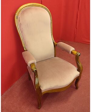 Armchair with reclining backrest