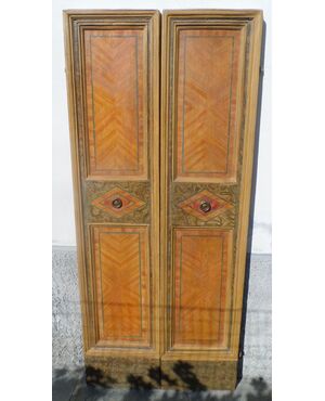 Marche leads to two tempera painted doors with neoclassical motifs