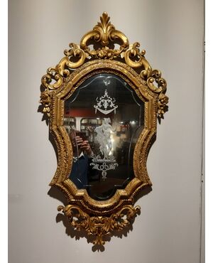 Carved and gilded Venetian mirror     