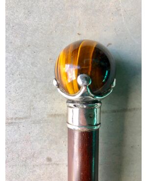 Stick with pommel in hard stone &#39;tugre&#39;e eye in silver. Rosewood handcuff.     