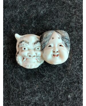 Netsuke &#39;in ivory with two faces: female face and demon. Japan     