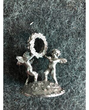 Set of six silver placeholders with putti.Italia     
