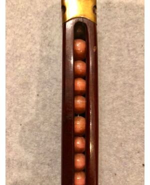 Deco stick with wooden knob containing &quot;agate&quot; hard stone spheres.     