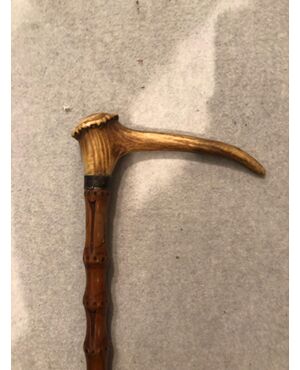 Animated stick with deer horn knob with corkscrew.     