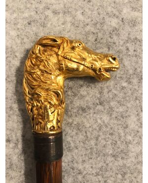 Defense stick with solid bronze pommel depicting a horse&#39;s head.     