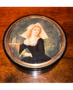 Papier mache box with ivory miniature depicting a lady with a bird.France.     