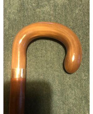 Stick with horn knob and low gold ring.     