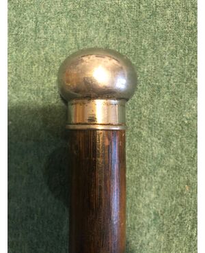 Perfume stick with metal knob and bottle inside.     