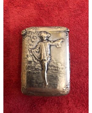Silver matchbox without punch with male character decoration and architecture.     
