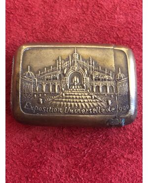 Brass matchbox depicting the 1900 universal Paris exhibition.     