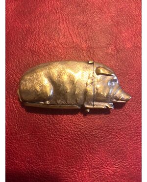 Silver-plated pig-shaped matchbox in bronze.     