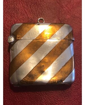 Silver matchbox with geometric striped decoration.England.     
