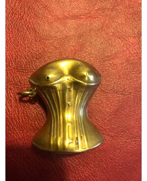 Brass matchbox with an erotic subject and a female bust.     