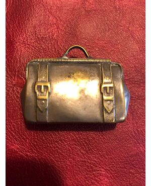 Metal matchbox in the shape of a briefcase.     