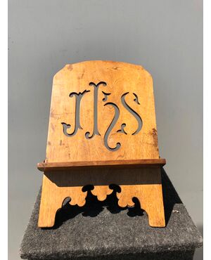 Adjustable lectern in carved and gilded wood with IHS motif of San Bernardino.     