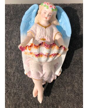 Holy water stoup in bisque porcelain with angel figure. France.     