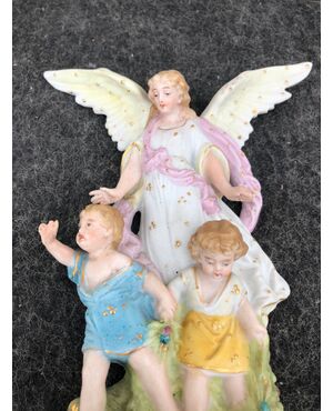 Bisque porcelain stoup with angel figure with outstretched wings protecting two children. France.     