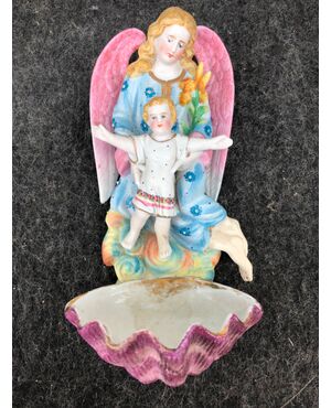 Bisque porcelain holy water stoup with angel figure protecting a boy. France.     
