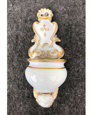 Holy water stoup in white and gold porcelain with tritons, putto and Bernardinian symbol Italy.     