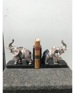 Pair of silver and terracotta wooden bookends depicting elephants. Signed. Italy.     