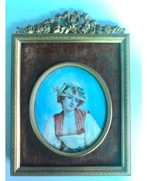Miniature on ivory with female figure. Bronze frame.     