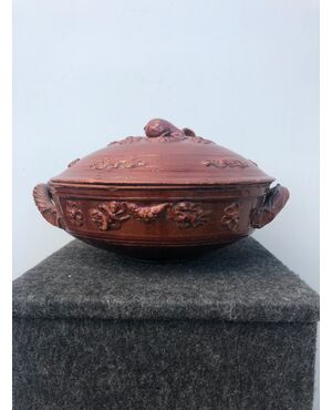 Engobed ceramic tureen with floral and geometric motifs in relief. Emilia Romagna.     